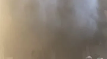 مصرع صغير في حريق محل ببرج سكني بشارع فيصل | صور
